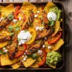 crispy sheet pan chicken fajita nachos - featured image